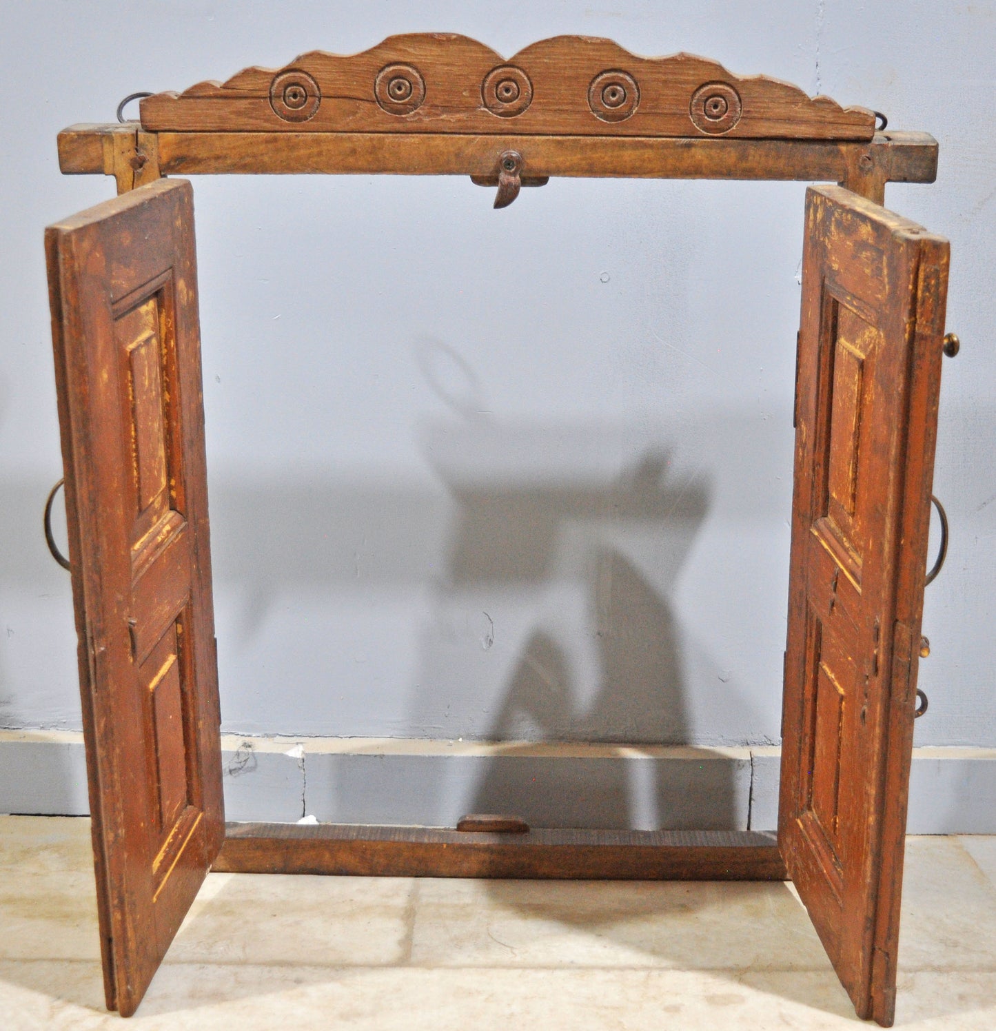 A beautiful old wooden window panel with frame, originally taken from an old house. Hand crafted in a nice shape, with original hardware. Good condition and a rich patina. Origin India.